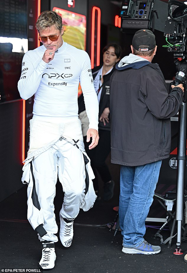 Pitt happily brought Inés along to Silverstone Circuit as he continued to shoot scenes for his new racing Apple Original film F1 over four days (pictured Saturday)