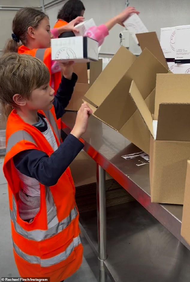 The former Miss Universe Australia winner, 36, shared a clip to Instagram on Monday capturing the youngsters hard at work packing boxes of her Kissed Earth line