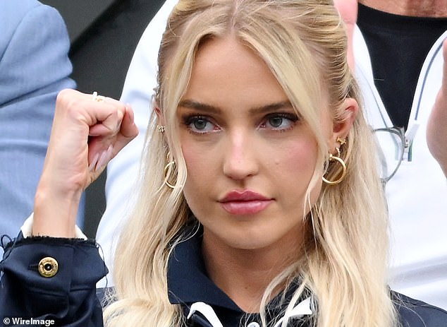 Tennis fan and social media star Morgan (pictured) looked intense as she cheered on her boyfriend during his match