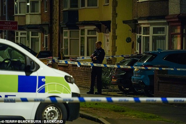 A police officer stands next to a police cordon in Geneva Road, Darlington, on Sunday night, July 7