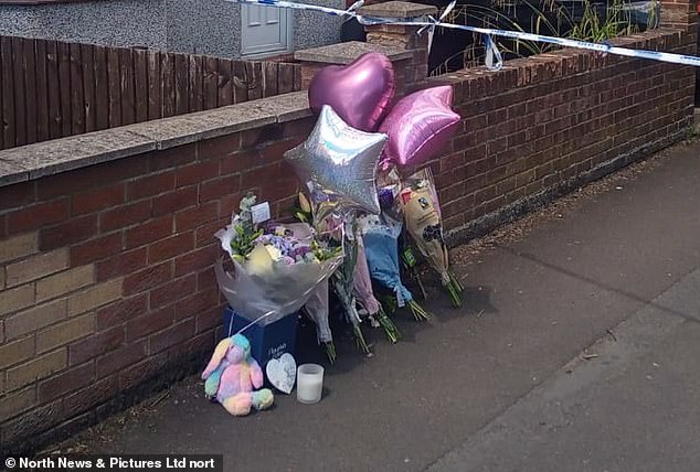 Floral tributes and balloons have been left outside Scarlett's house by heartbroken friends and neighbours