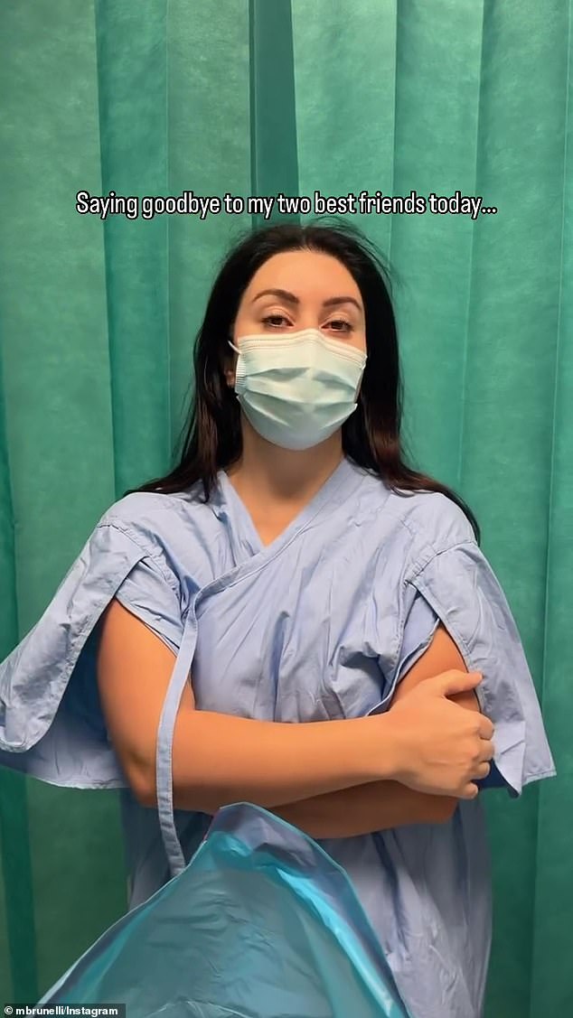 The 33-year-old personal trainer joked that he was 'saying goodbye to my two best friends today'. Martha (pictured) dressed in a hospital gown as she prepared for the procedure