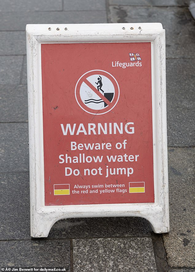 Signs in the area warn against jumping from the pier - but youngsters congregate at the area every weekend in the summer, and jump into the sea with friends