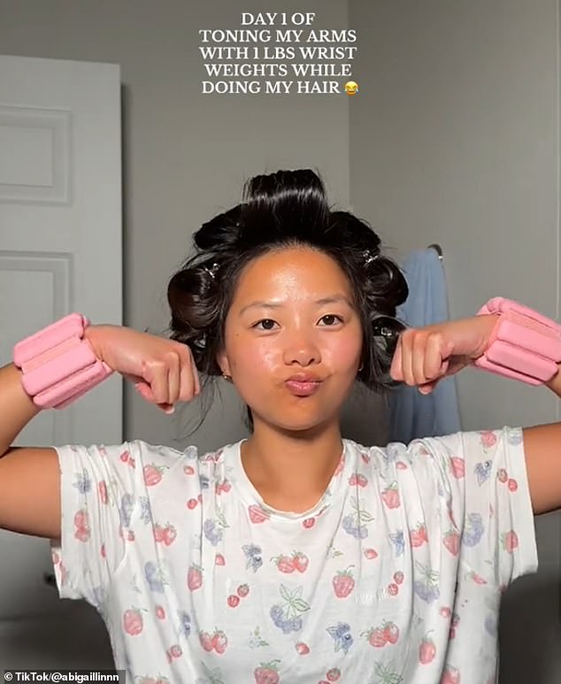 Hair influencer Abigail Lin also took her one-pound wrist weights for a twirl while she blew dry her hair and put it in curlers