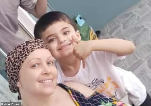 Beatriz Aparecida Frederico, 33, and her youngest child, David Miguel Frederico de Oliveira, five, were on their way to a theme park when their car slammed into another vehicle during a rainstorm on Sunday in Lages, Brazil . (pictured: The mother and son in February)