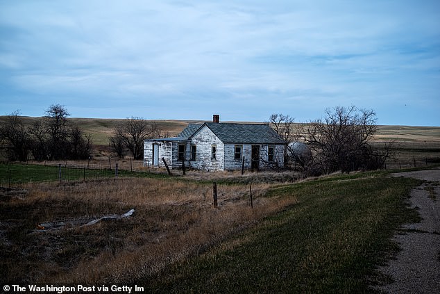 Above, an abandon house on 236 Winifred Highway located in Fergus County, Montana on April 8, 2022. 'Fergus County, as a county, has the most missiles,' county commissioner Ross Butcher told DailyMail.com. 'We have 52 missiles in our county'