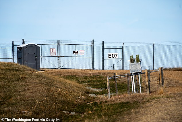 To passers by, they look like just another abandoned lot or fenced enclosure: a cattle grazing area, remnants of an electrical transformer site, a sewer utility access point. Above, one such underground nuclear missile silo in Fergus, Montana