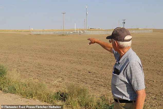 Above, Young points to the ICBM nuclear silo buried on his farm