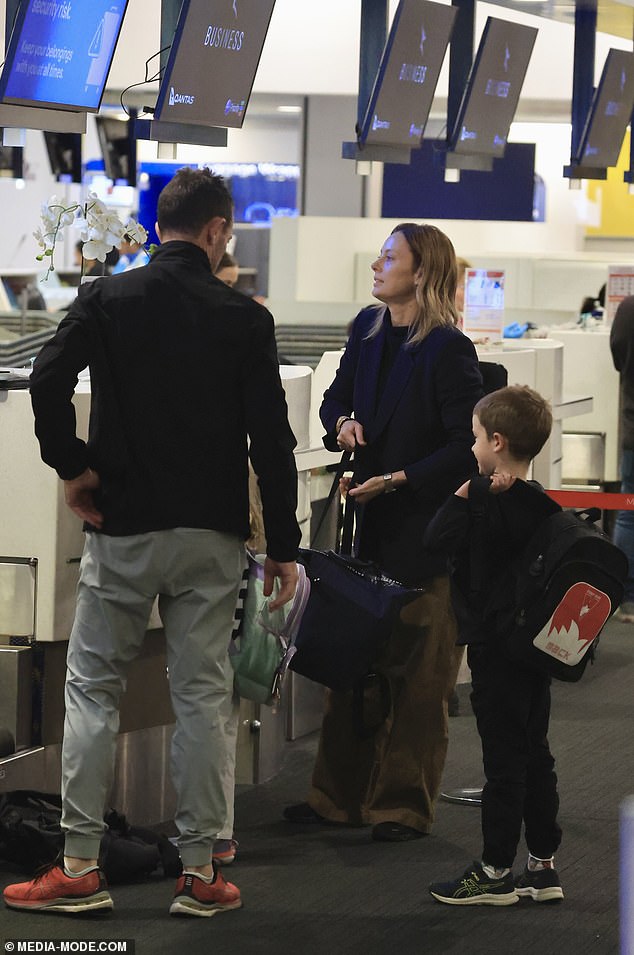 A woman has accused Qantas of giving ACA host Allison Langdon special treatment on a flight from Sydney to Fiji - despite her being 'seated in economy'. However, photos obtained by Daily Mail Australia show Langdon and her family checking in at the business class desk