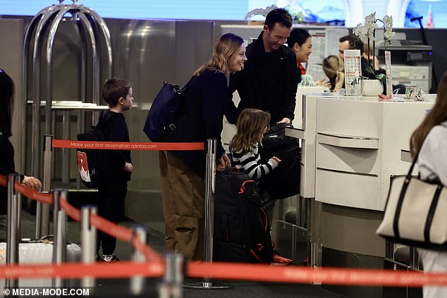 A woman has accused Qantas of giving ACA host Allison Langdon special treatment on a flight from Sydney to Fiji - despite her being 'seated in economy'. However, photos obtained by Daily Mail Australia show Langdon and her family checking in at the business class desk