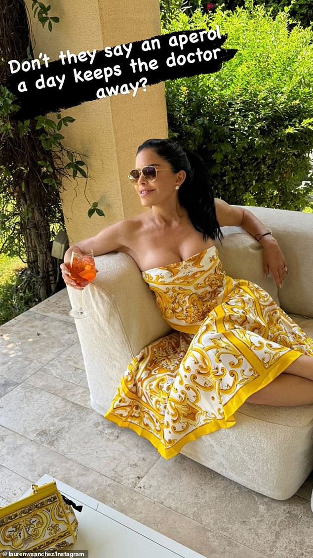 Sanchez sipped on an Aperol spritz while wearing a Dolce & Gabbana dress in a new photo shared to social media last week