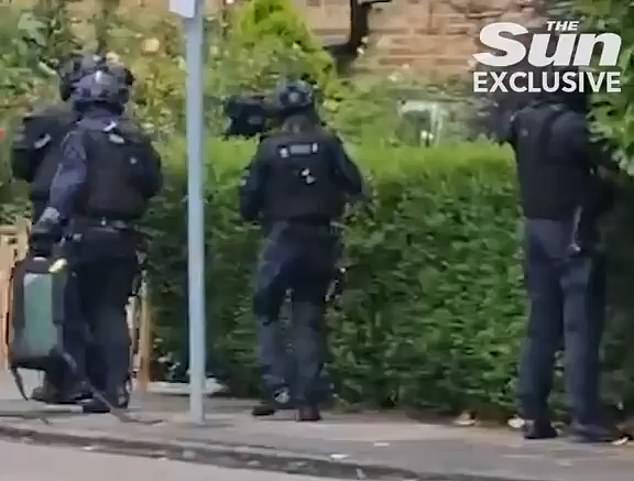 Dramatic footage shows police storming a home in Enfield as part of the hunt for triple murder suspect Kyle Clifford, 26