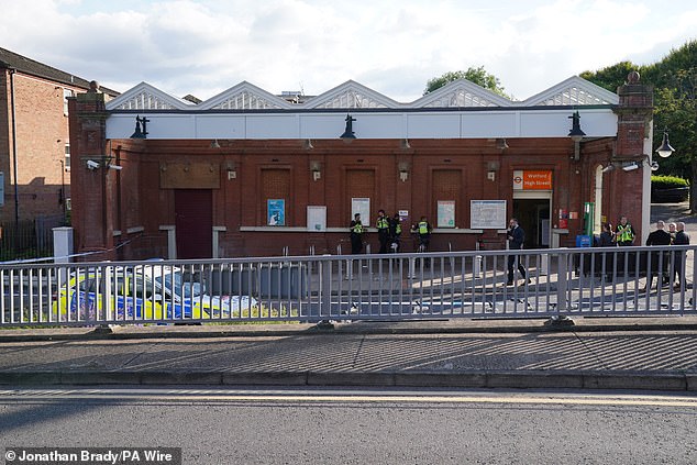 A police cordon outside Watford Hight Street Station in Hertfordshire as the search for Clifford continued