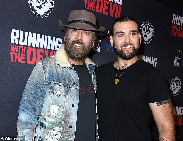 Nicolas Cage 's son Weston, 33, was arrested for allegedly assaulting his mother during a mental health crisis. (pictured: Nicolas and Weston in 2019)