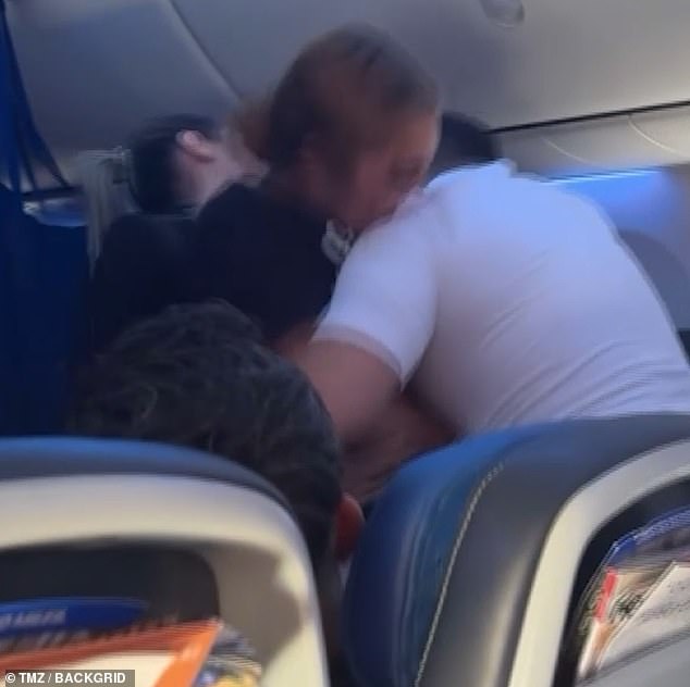 A passenger bit a chunk of fabric out of a flight attendant's shirt in a mid-fight meltdown