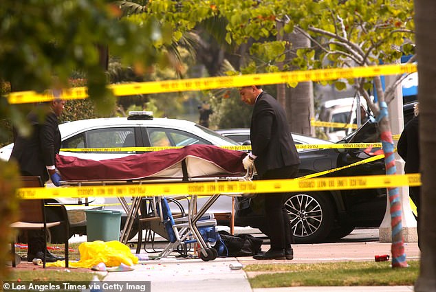 A victim from the random attack is taken away as law enforcement officers investigate the scene at the corner of 16th Street and Pecan Avenue in Huntington Beach