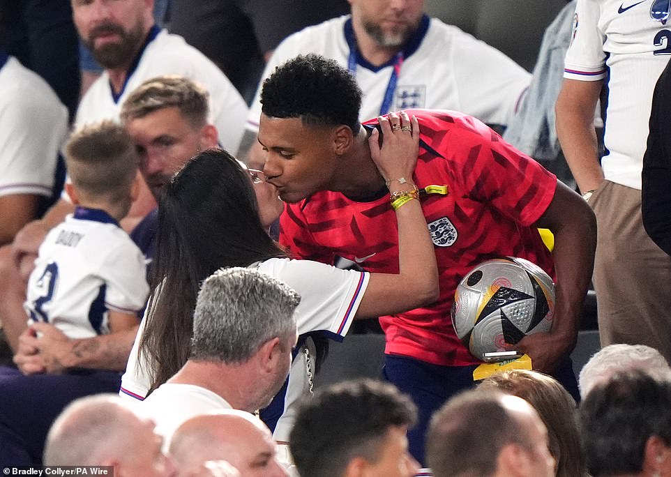 Ollie Watkins kisses his partner Ellie Alderson in the stands after scoring the winning goal against the Netherlands to book England's spot in the Euro 2024 final