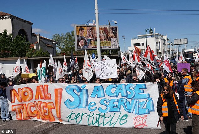 In April, when the new fee launched, demonstrators armed with signs and banners lined the historic canals