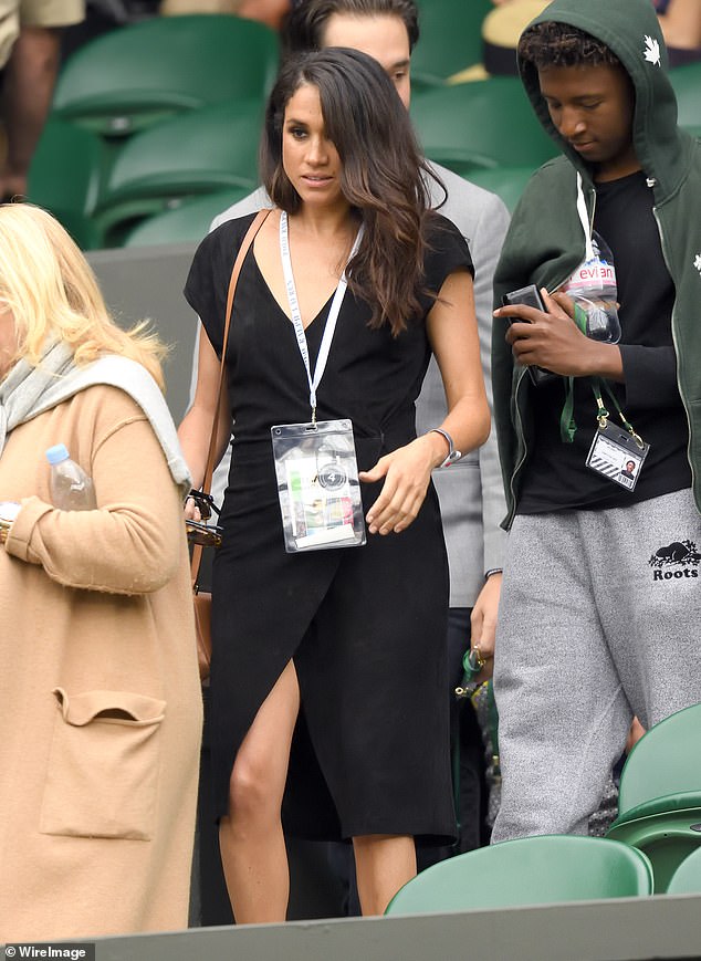 Meghan Markle attends day eight of the Wimbledon Tennis Championships in July 2016 - the same month she is believed to have met Prince Harry