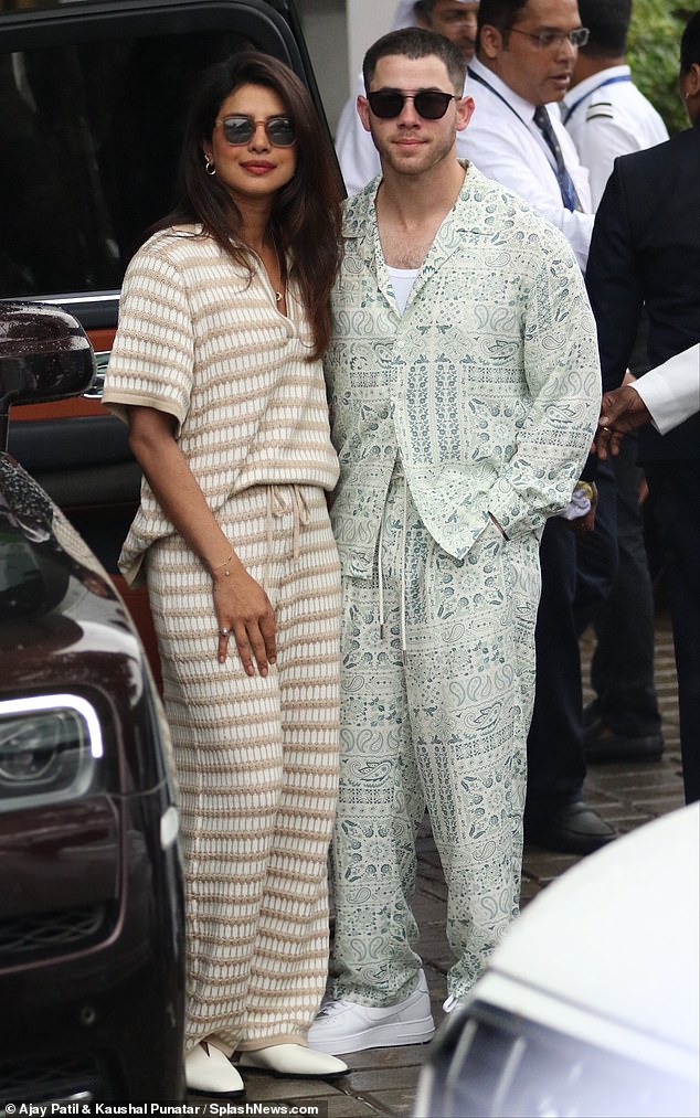 Priyanka Chopra and her husband Nick Jonas cut casual figures on Thursday as they touched down in Mumbai ahead of their pal's lavish wedding on Friday