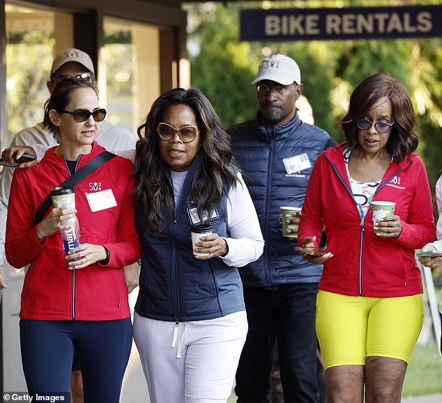 Best friends Oprah Winfrey and Gayle King were also seen at the billionaire's conference, walking alongside Van Jones and Jackie Hindawi (left)