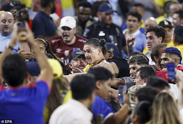 Colombia's win over Uruguay in the Copa America semifinals descended into chaos on when Darwin Nunez (center) leapt into the crowd and swung punches at opposition fans