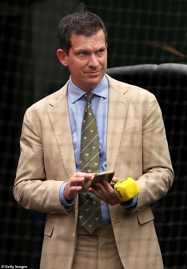 Tim Henman looks on on Centre Court during day eight of Wimbledon