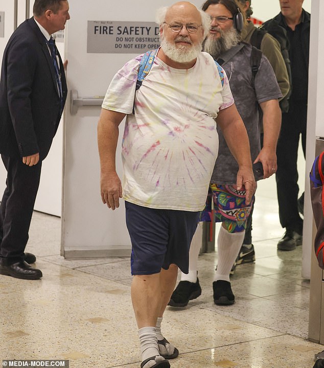 Meanwhile, bandmate Kyle Gass kept it casual with a white T-shirt, blue shorts and black slides with socks. Pictured