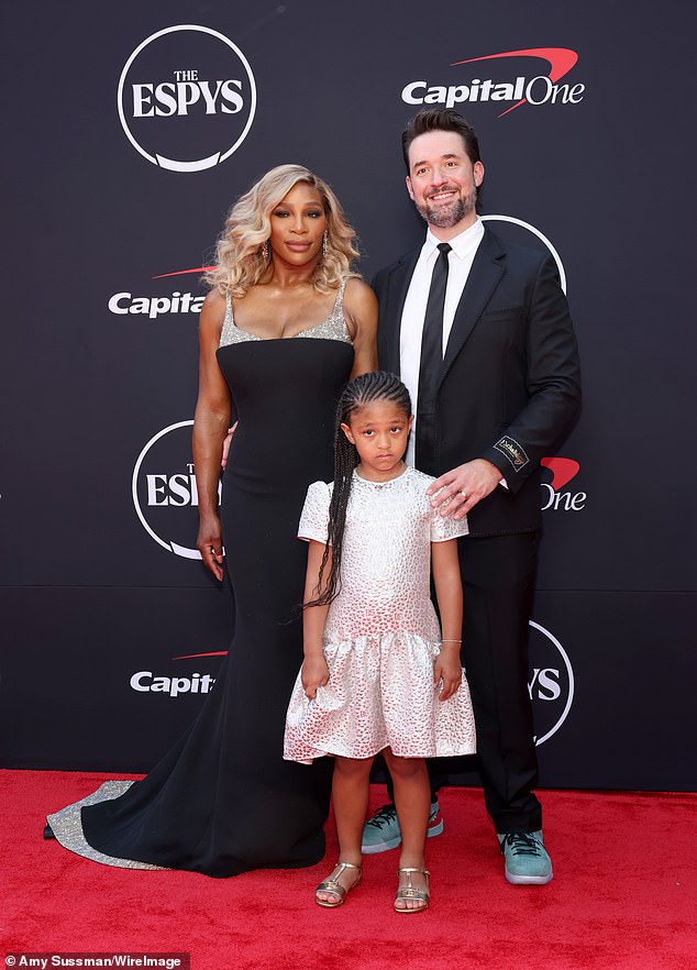 The Michigan-born athlete was supported at The Espys by her 6ft5in husband - Alexis Ohanian Sr. (R) - wearing a 'gentleman's mullet' with his classic black Gucci suit and turquoise Nike sneakers