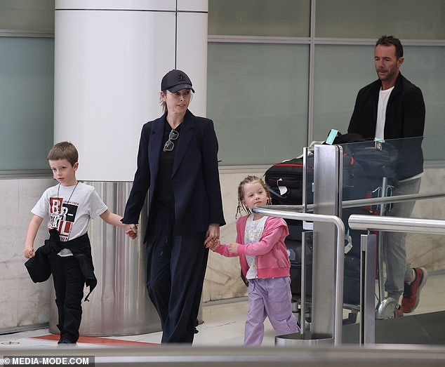 Allison, 45, did not appear fussed about the accusations as she strolled through Sydney Airport on Friday with her husband Michael Willesee Jr. and their two children - son Mack, 7, and daughter Scout, 4