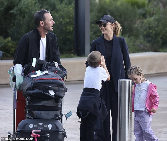 She looked as stylish as ever in a chic black blazer paired with a matching T-shirt and baggy trousers