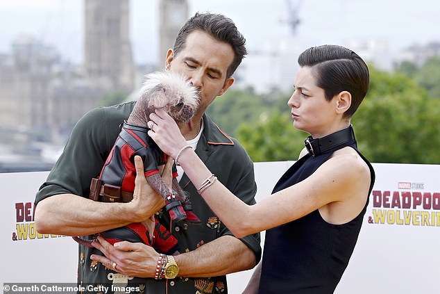 Emma, Ryan, 47, and Hugh, 55, were joined in their photos by Pug and Chinese Crested Dog cross Peggy, who received the title of Britain's Ugliest Dog in 2023