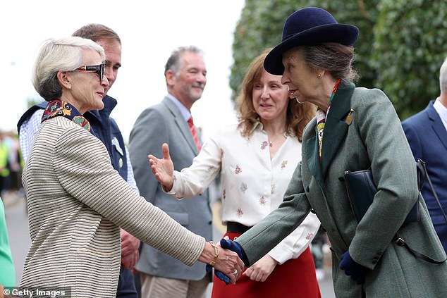 Princess Anne is pictured shaking hands with guests as she attended an event at the Riding for the Disabled Association (RDA) National Championships on Friday afternoon