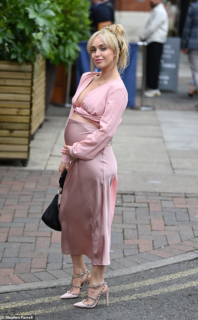 Jorgie put her blossoming baby bump on display in a front tie crop top with a plunging neckline that exposed her stomach