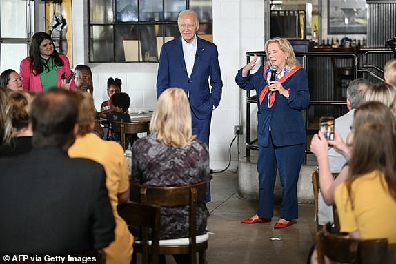 US President Joe Biden listens to US Representative Debbie Dingell, Democrat of Michigan, speak during a stop at the Garage Grill & Fuel Bar in Northville, Michigan, ahead of a campaign event in Detroit on July 12, 2024. (Photo by Mandel NGAN / AFP) (Photo by MANDEL NGAN/AFP via Getty Images)