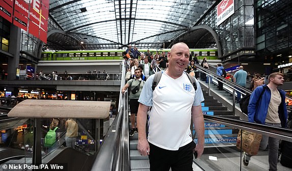 England fans arrive at Berlin Central Train Station, Germany. England will play Spain in the UEFA Euro 2024 final on Sunday. Picture date: Friday July 12, 2024. PA Photo. See PA Story SOCCER England. Photo credit should read: Nick Potts/PA Wire.RESTRICTIONS: Use subject to restrictions. Editorial use only, no commercial use without prior consent from rights holder.