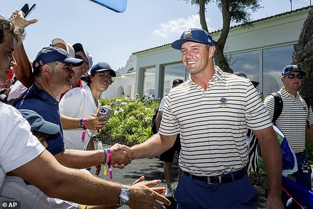 Captain Bryson DeChambeau of Crushers GC greets fans before the second round in Spain