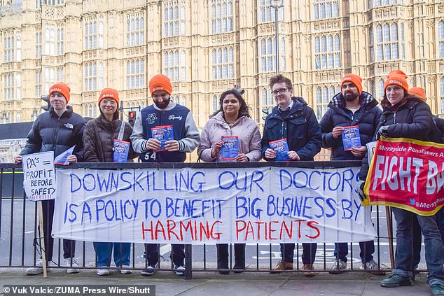 Demonstrators gather outside Parliament in protest against handing over responsibilities to physician associates who have limited medical training and are not doctors