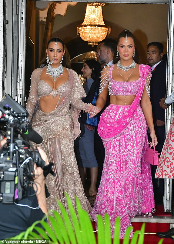 Kim and Khloe Kardashian seen in traditional outfits as they leave their hotel in India., The sisters travelled to India for the world's most lavish wedding! Indian billionaire heir Anant Ambani and Radhika Merchant married at a star-studded £250m ceremony in Mumbai, also attended by John Cena, Nick Jonas and Tony Blair. 13 Jul 2024 Pictured: Kim and Khloe Kardashian. Photo credit: Varinder Chawla / MEGA  TheMegaAgency.com +1 888 505 6342