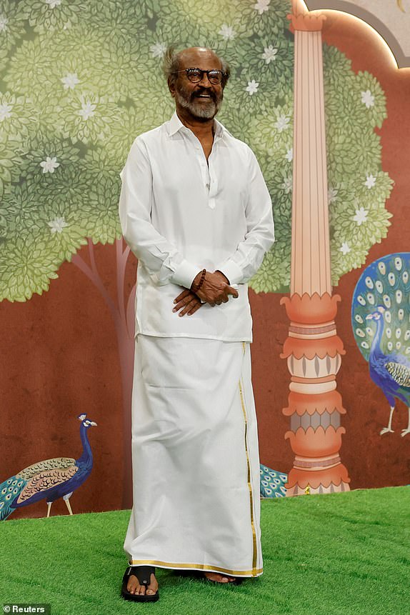 Indian actor Rajinikanth poses for pictures on the red carpet as he attends the blessing ceremony of Anant Ambani and Radhika Merchant after their marriage in Mumbai, India, July 13, 2024. REUTERS/Francis Mascarenhas