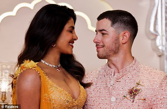 Nick Jonas and Priyanka Chopra look at each other, on the day of the wedding of Anant Ambani and Radhika Merchant in Mumbai, India, July 12, 2024. REUTERS/Francis Mascarenhas