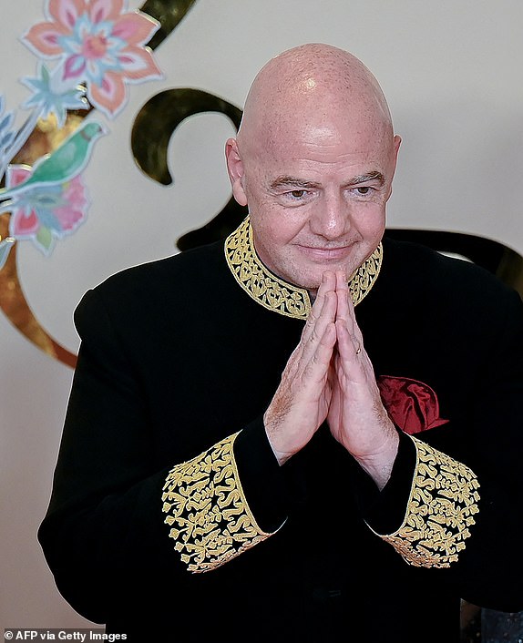 FIFA President Gianni Infantino gestures as he arrives to attend the wedding ceremony of billionaire tycoon and Chairman of Reliance Industries Mukesh Ambani's son Anant Ambani and Radhika Merchant in Mumbai on July 12, 2024. Socialite sisters Kim and Khloe Kardashian were among the global celebrities spotted in India on July 12 to attend a lavish three-day wedding ceremony staged by Asia's richest man Mukesh Ambani. (Photo by Punit PARANJPE / AFP) (Photo by PUNIT PARANJPEPUNIT PARANJPE/AFP via Getty Images)