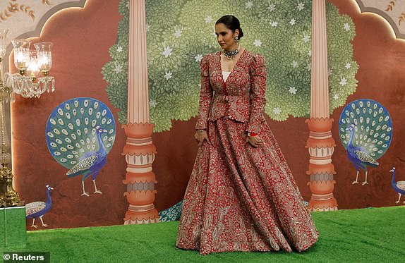 Former Indian professional tennis player Sania Mirza poses for pictures on the red carpet as she attends the blessing ceremony of Anant Ambani and Radhika Merchant after their marriage in Mumbai, India, July 13, 2024. REUTERS/Francis Mascarenhas