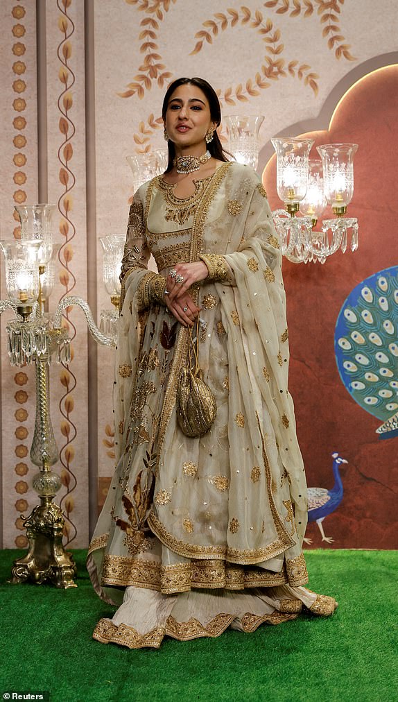 Bollywood actor Sara Ali Khan poses for pictures on the red carpet as she attends the blessing ceremony of Anant Ambani and Radhika Merchant after their marriage in Mumbai, India, July 13, 2024. REUTERS/Francis Mascarenhas