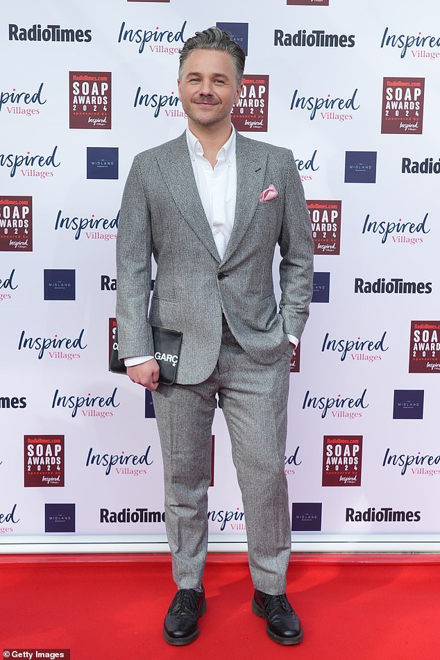 David Ames cut a dapper figure in a grey suit with a white shirt