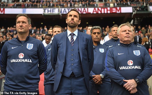 Southgate, pictured in 2018 with Steve Holland (L) and Sammy Lee (R) took on the England job in 2016 as Sam Allardyce's successor after previously insisting he didn't want to take the job on