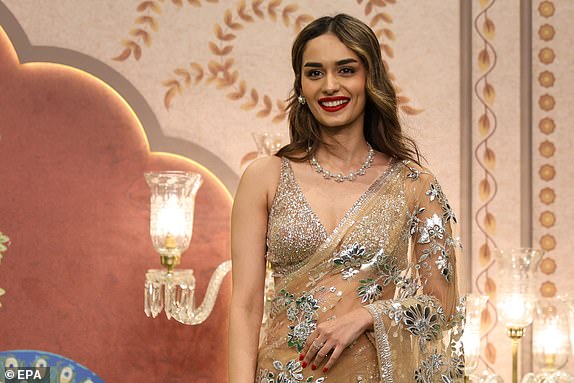 epa11476052 Indian actress and former 'Miss World' Manushi Chhillar poses for photographs prior to attending the blessing ceremony of Anant Ambani, son of Reliance Industries chairman Mukesh Ambani post wedding ceremony, in Mumbai, India, 13 July 2024. Various global celebrities have arrived in Mumbai to attend the grand wedding of Anant Ambani and his bride Radhika Merchant.  EPA/DIVYAKANT SOLANKI