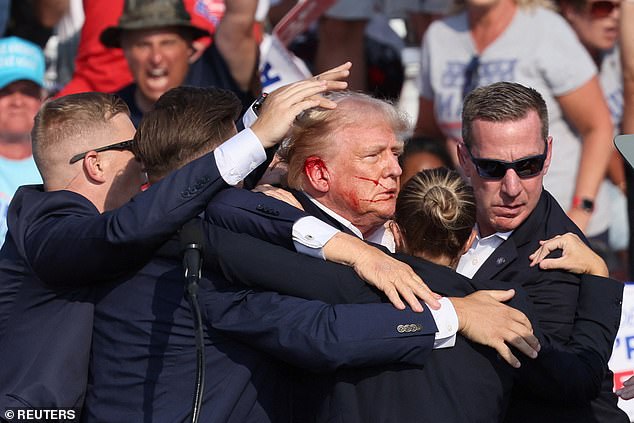 North Dakota Gov. Doug Burgum wrote: 'Please join Kathryn and me in praying for President Trump, his family and everyone attending the rally today'