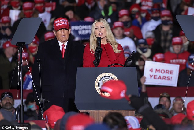 President Donald Trump listens as his daughter Ivanka Trump speaks during a campaign rally at the Kenosha Regional Airport on November 02, 2020 in Kenosha, Wisconsin