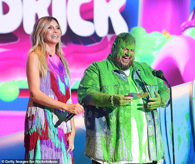 During the ceremony, Jelly Roll, who was nominated for Breakout New Artist, took the stage to present with supermodel Heidi Klum at one point